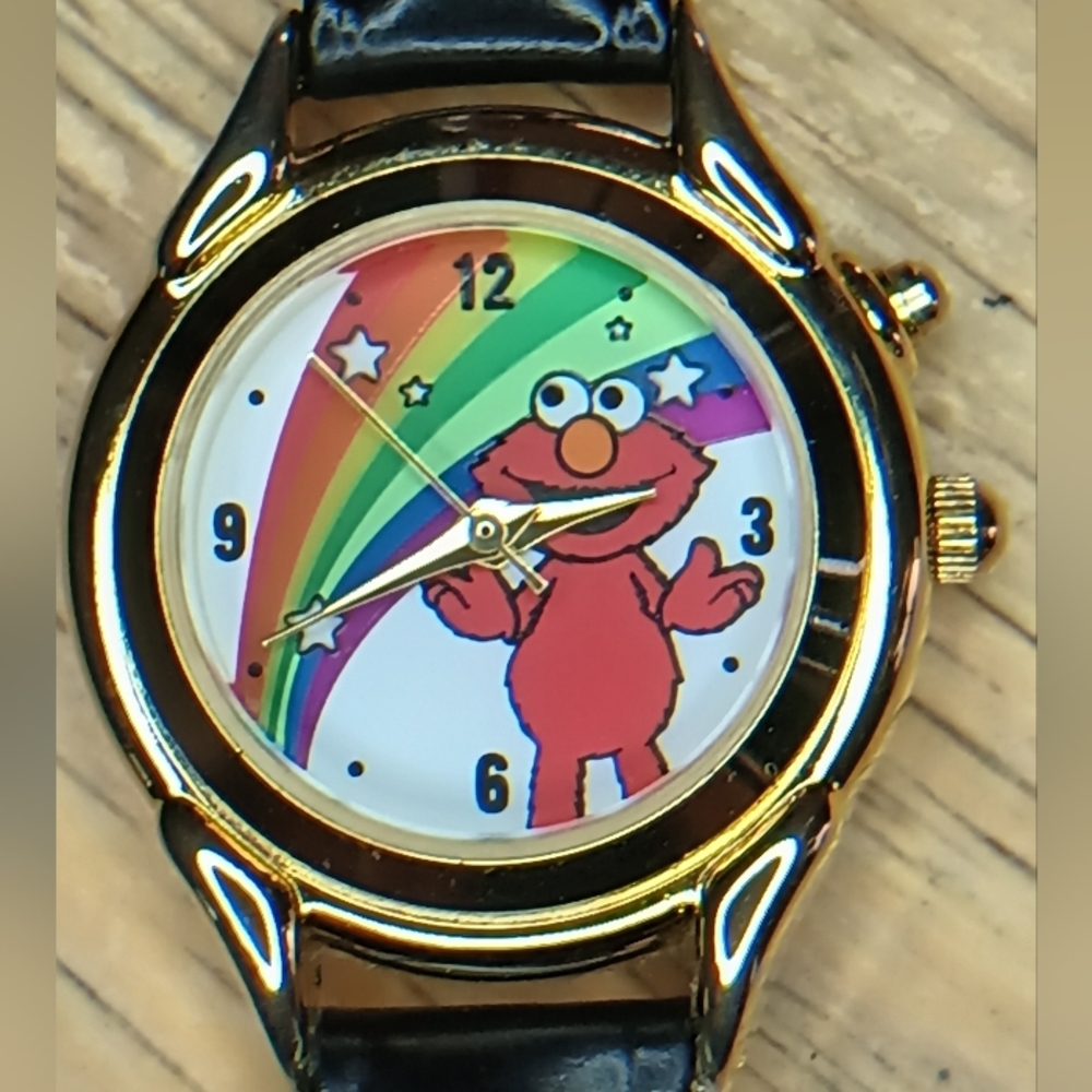 X Fantasma Elmo "light up". 28mm gold tone case, steel back, black leather band